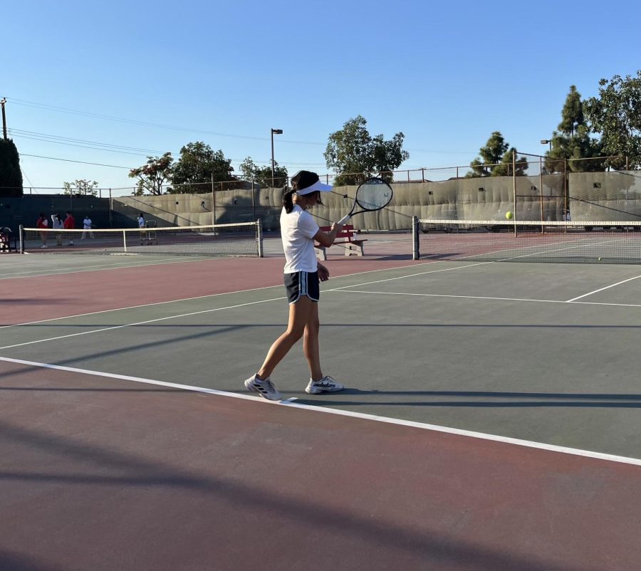 Swinging+Into+Action%3A+Jolie+Diep%2C+one+of+three+freshmen+on+a+varsity+team+this+season%2C+scores+a+point+in+tennis+practice.