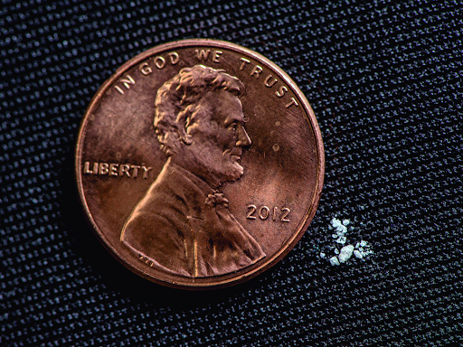 Little yet lethal: The size of a fatal dosage of fentanyl compared to a penny for reference. 