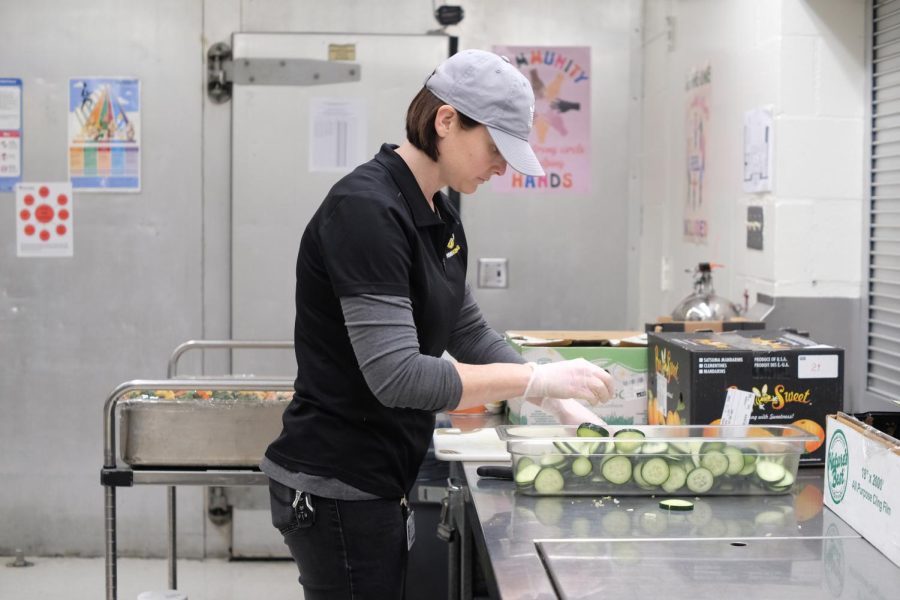 Greening it up: Cafeteria manager Tiffany Camarillo chops and bins cucumber slices for Tuesday’s fresh and tasty salad bar.