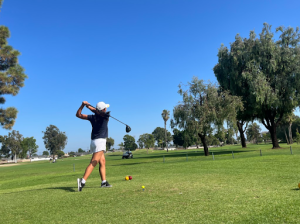 Off the Tee: Team captain and junior Melody Oh at the tee box against Gahr on Aug. 31 (Photo by Trisha Hua)
