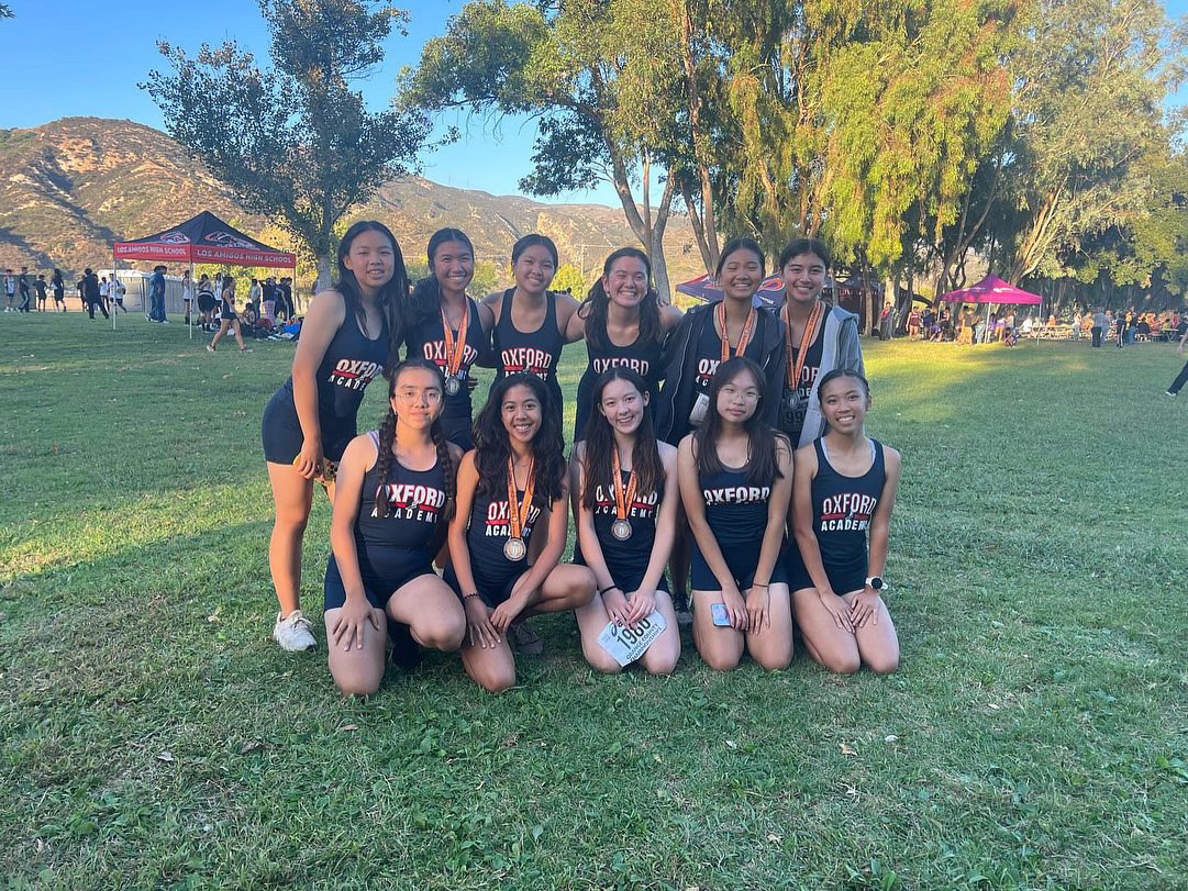 Running Through: The girls varsity cross-country team poses after the OC Championships Invitational  (Photo by Lynn Grepo)