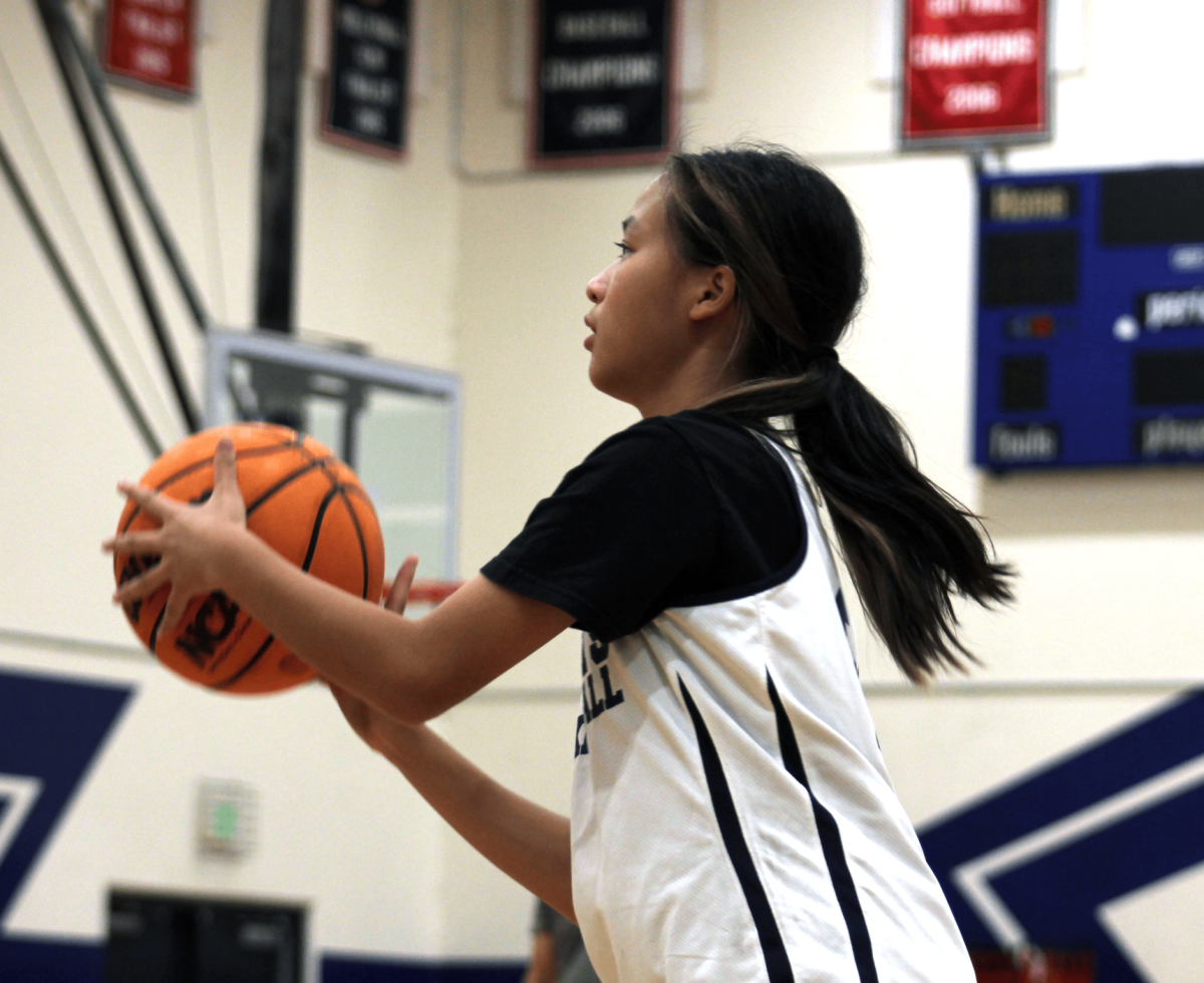 Breaking the Basket: Freshman Chloe Chen during varsity practice, prepping hard for the season. (Photo by Tyler Nguyen)
