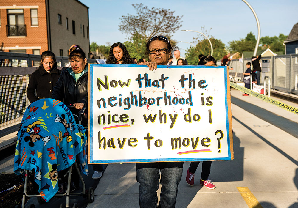 Protesting for Protection: Chicago residents call for action against the 606 trail construction in 2016 that displaced residents in the name of industrial growth and was inattentive to their needs and lives. (Photo by Tyler Pasciak LaRiviere)