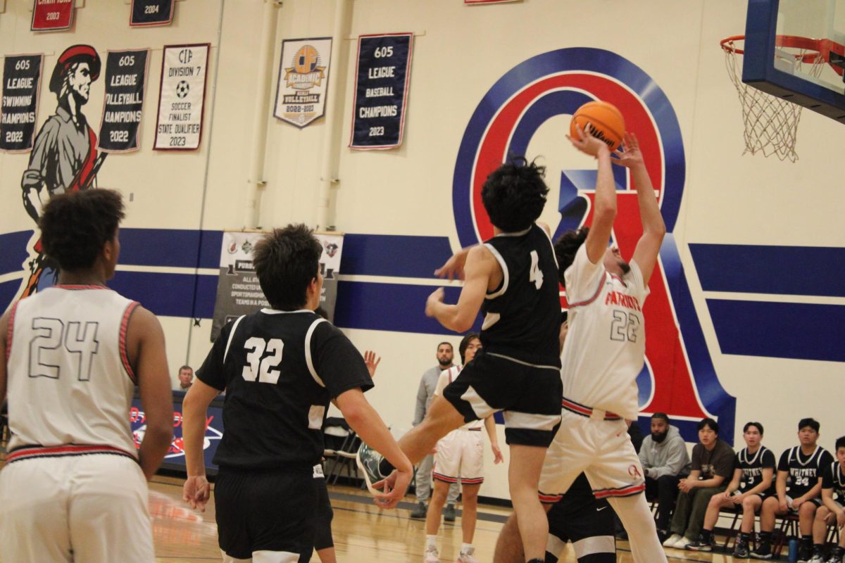 
Ready for a challenge: Junior Gabriel Chaparro goes for the shot as a Wildcat attempts to block him.
