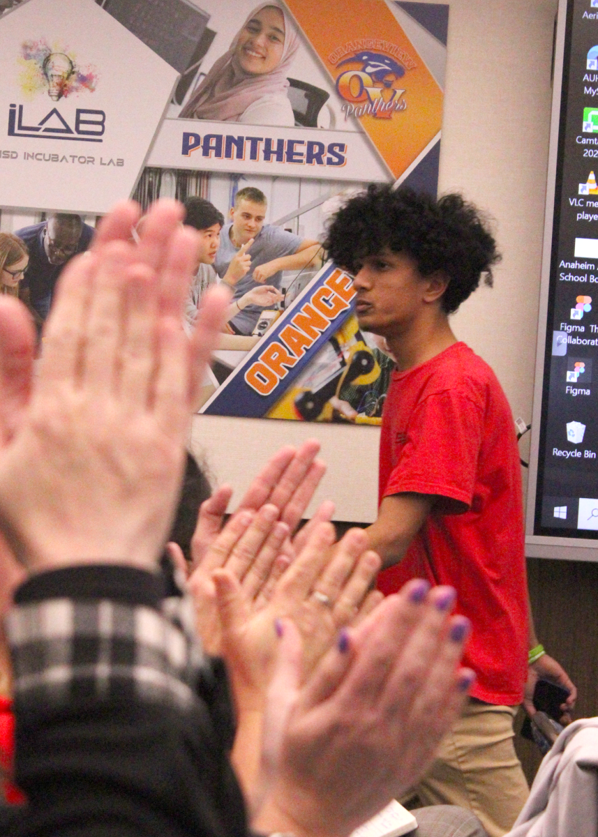 Oxford Academy senior Luqman Muhammad garners reaction from the public audience following his speech at March 7 AUHSD Board of Trustees meeting.