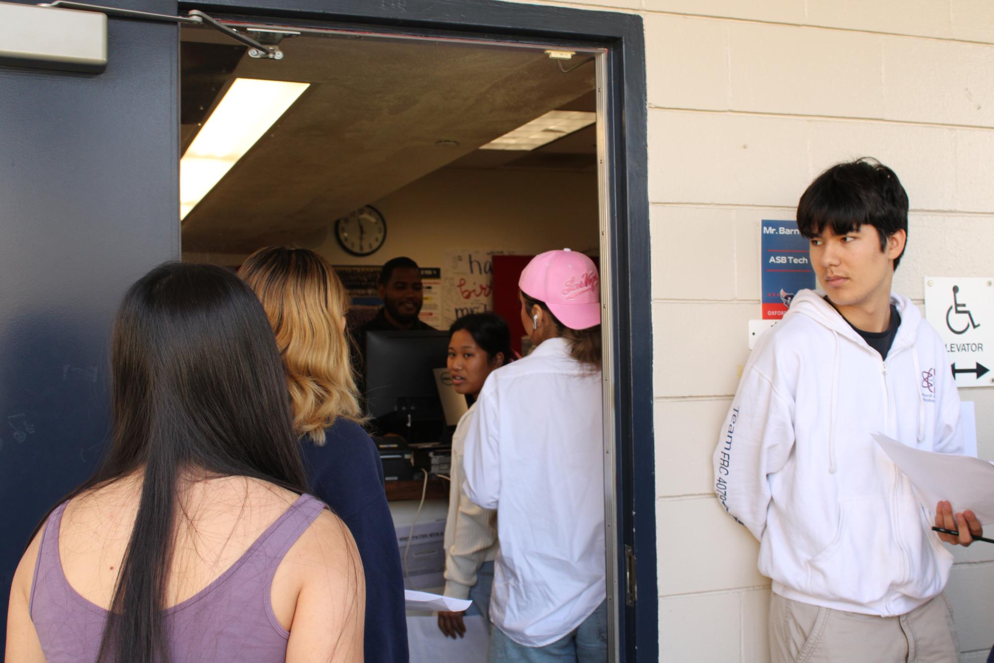 Students brave long lines to pay for AP exams