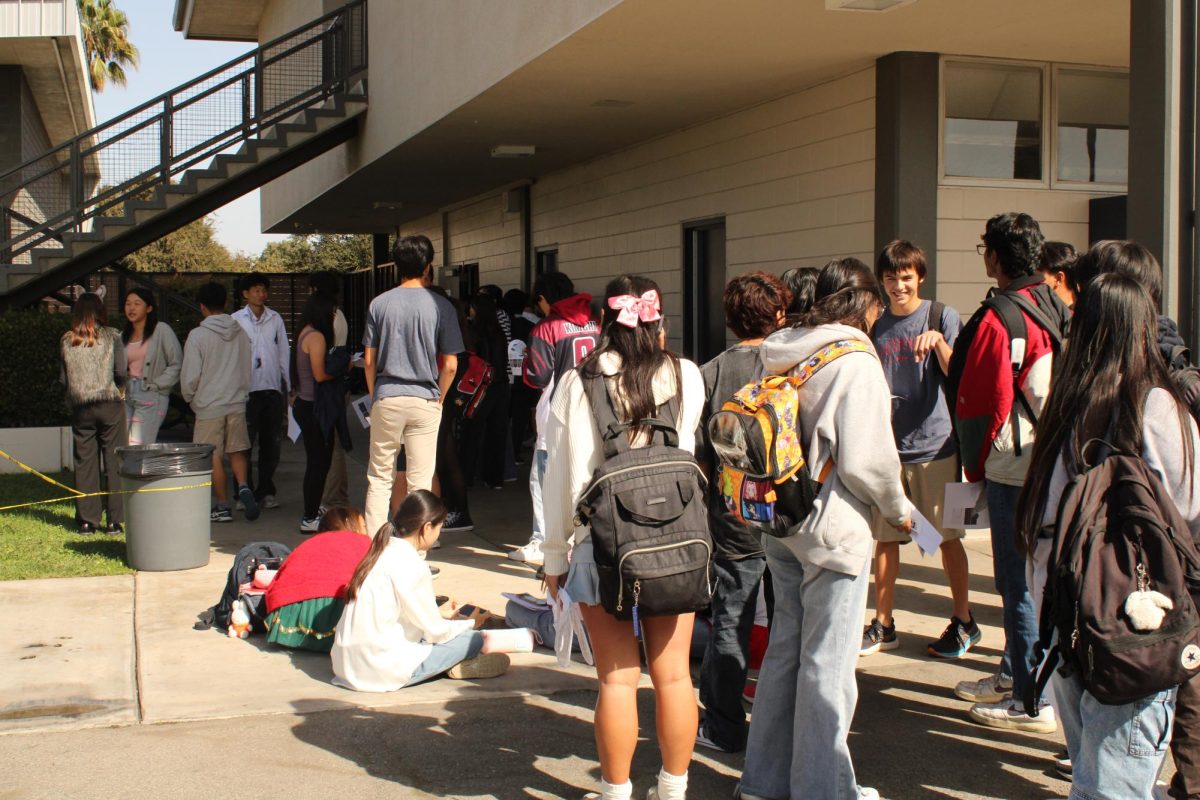 CAMP OUT: The long line to pay for AP exams resembled the queue for a sold-out concert. Today was the last day to pay for the tests.