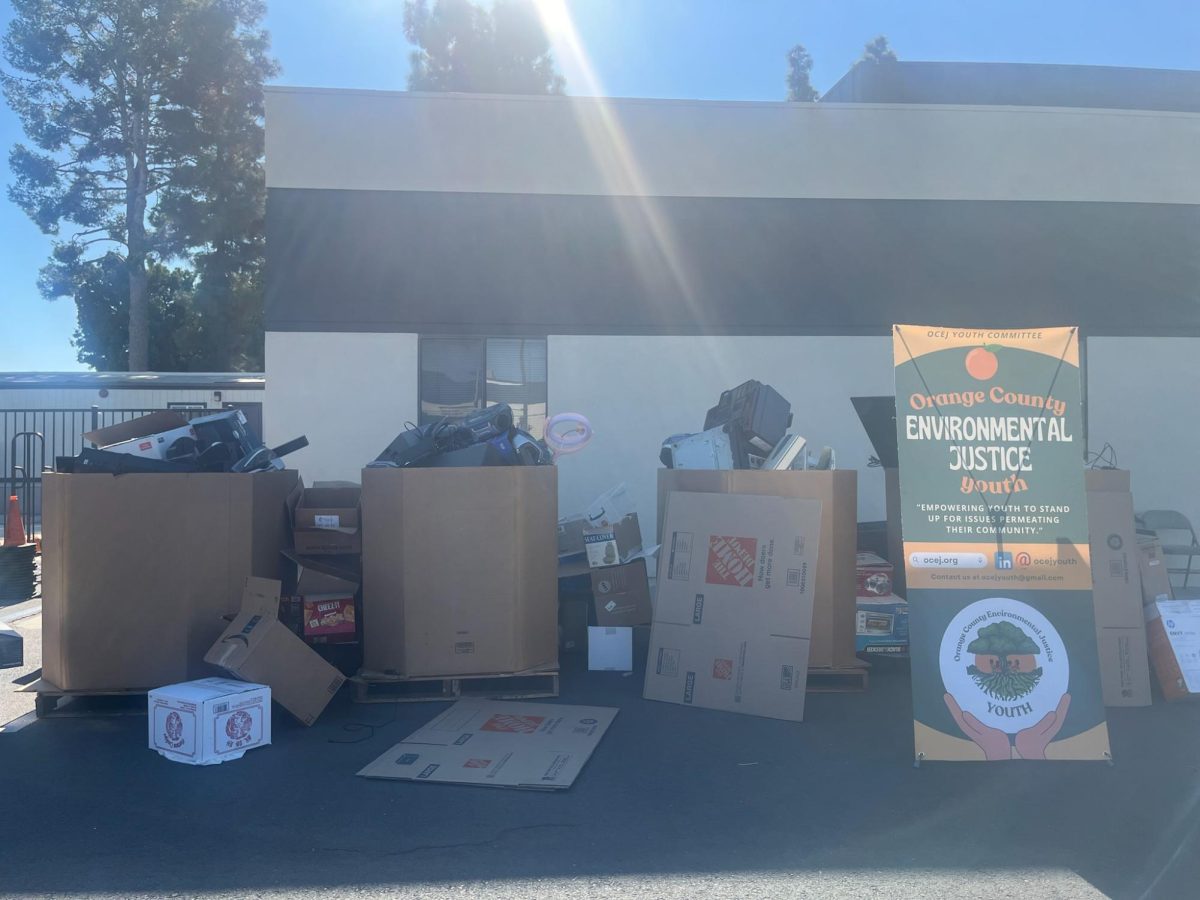 CREATING CHANGE: Orange County Environmental Justice (OCEJ) Youth Committee organizes piles of e-waste into multiple boxes