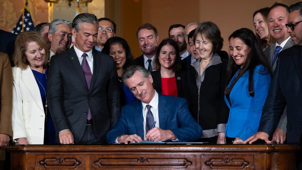 Taking Action: California Governor Gavin Newsom signs bills into law with fellow policymakers. 