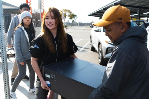 Cleaning up the Community: OA Robotics and ECO members work together to collect electronic waste from the community during their Servathon event 