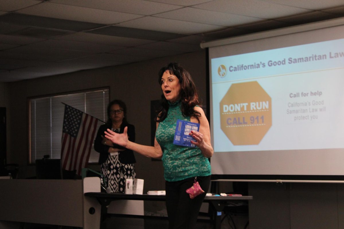 Spreading Awareness: OCHCA presenter Della Lisi Kerr displays a fentanyl test strip to supplement a presentation for the Fentanyl Awareness Workshop.