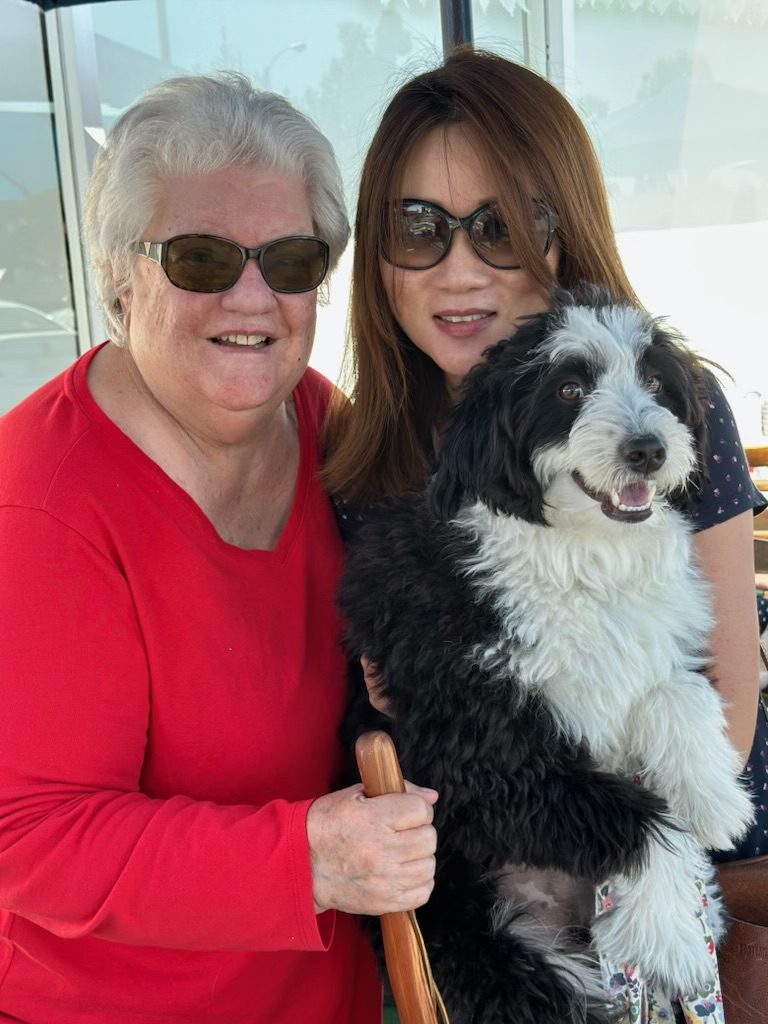 Cherishing Friendship: Math teachers Mrs. Jeanne Beckett, Ms. Susie Min, and Ms. Min's dog Cooper, who Mrs. Beckett gifted to her. (Photo courtesy of Susie Min)