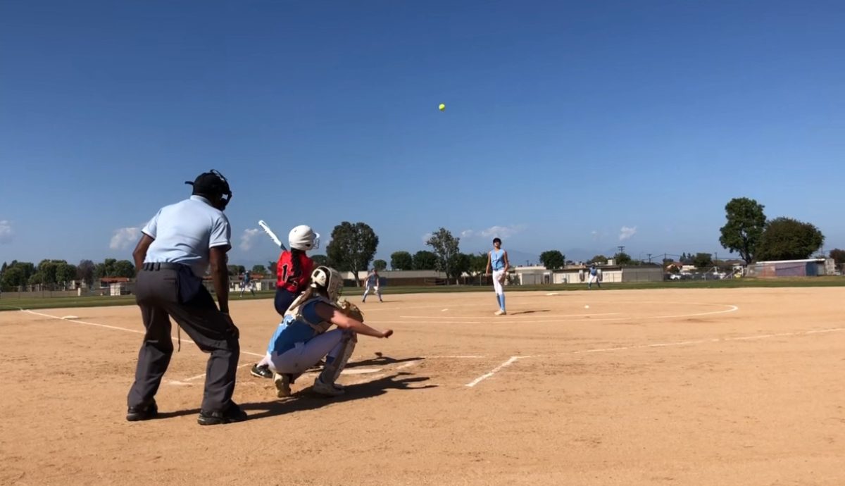 FULL SWING: Intramural athlete from the 24-25 season, freshman Camelot Tran hits a home run in an intramural softball game in last year’s game against Lexington. (Photo by: Camelot Tran)