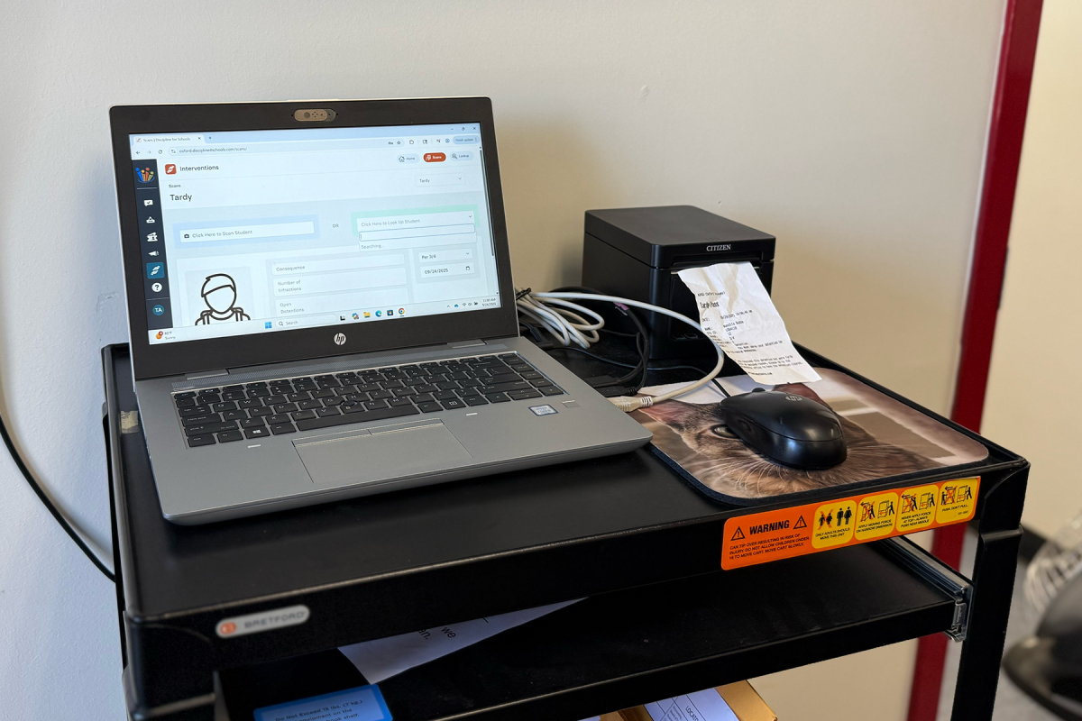 TARDY SLIP: Upon walking in, tardy students scan in and are assigned an automatic detention at Oxford's attendance office.
