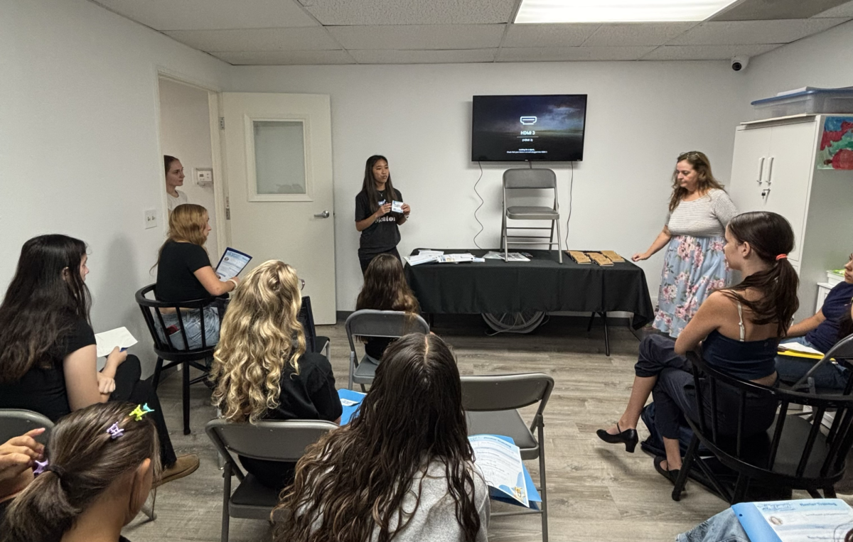 TRANSCENDING LIMITS: Trina So leads members of the No Limits Youth Committee in a kickoff training, teaching American Sign Language and sharing mentorship tips. (Photo courtesy of Trina So)