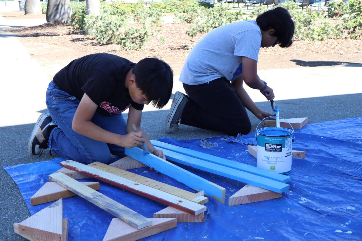 SETTING THE STAGE: OA Singers put together Mamma Mia! props and set during workshop days on Saturday (10/18).