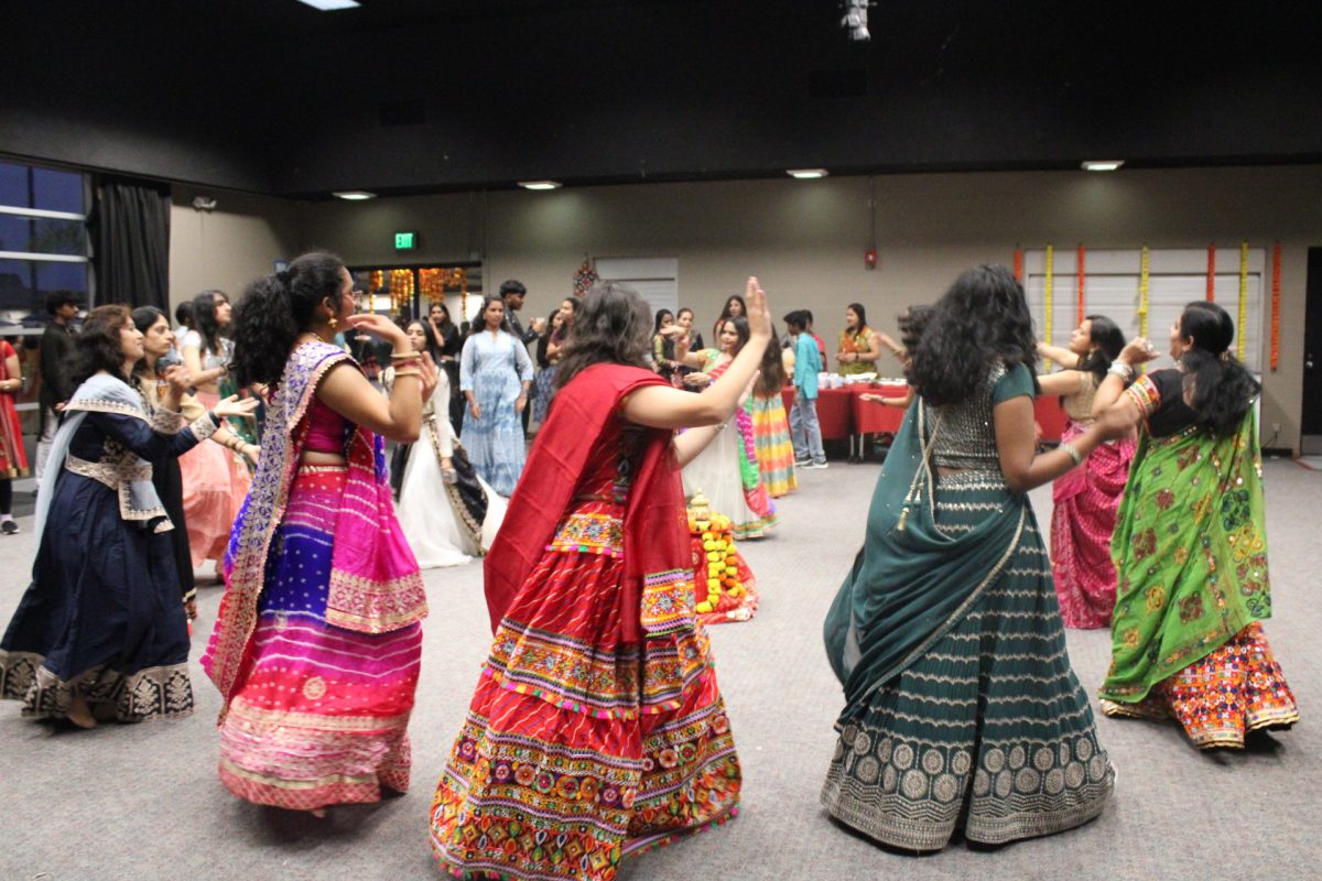 GARBA CIRCLE: Students form a lively circle on the dance floor.
