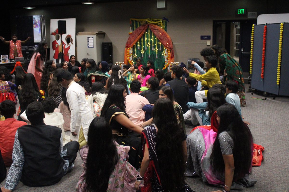 CHOREOGRAPHY MOMENT: Students follow the DJ’s lead and drop to the floor together during the dance.