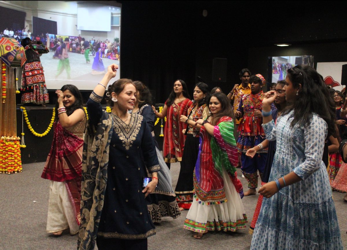 LEADING THE CELEBRATION: The PTSA moms who planned the event jump into the dancing with enthusiasm.