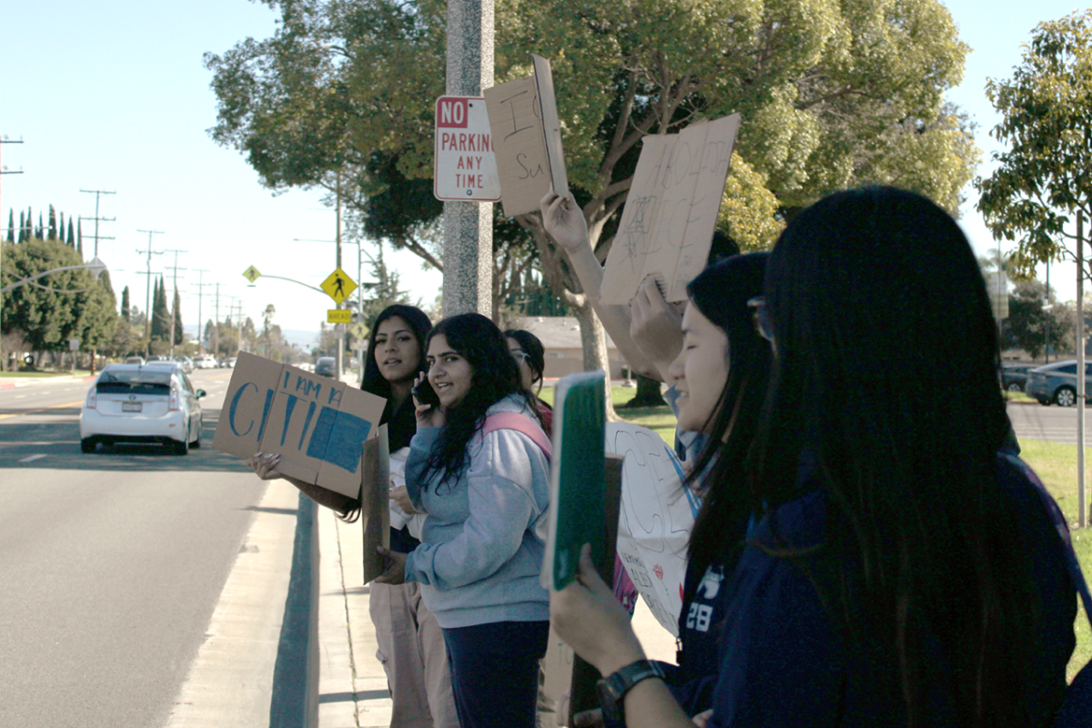 SPREADING THE WORD: Oxford seniors protest on Orange Avenue.