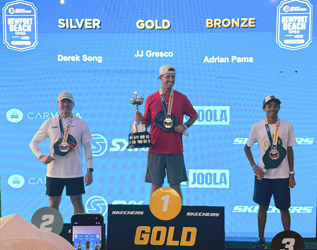 CLIMBING TO THE TOP: Adrian Pama poses with his bronze medal on the podium at the PPA Newport Beach Open on March 6. (Photo courtesy of Adrian Pama)