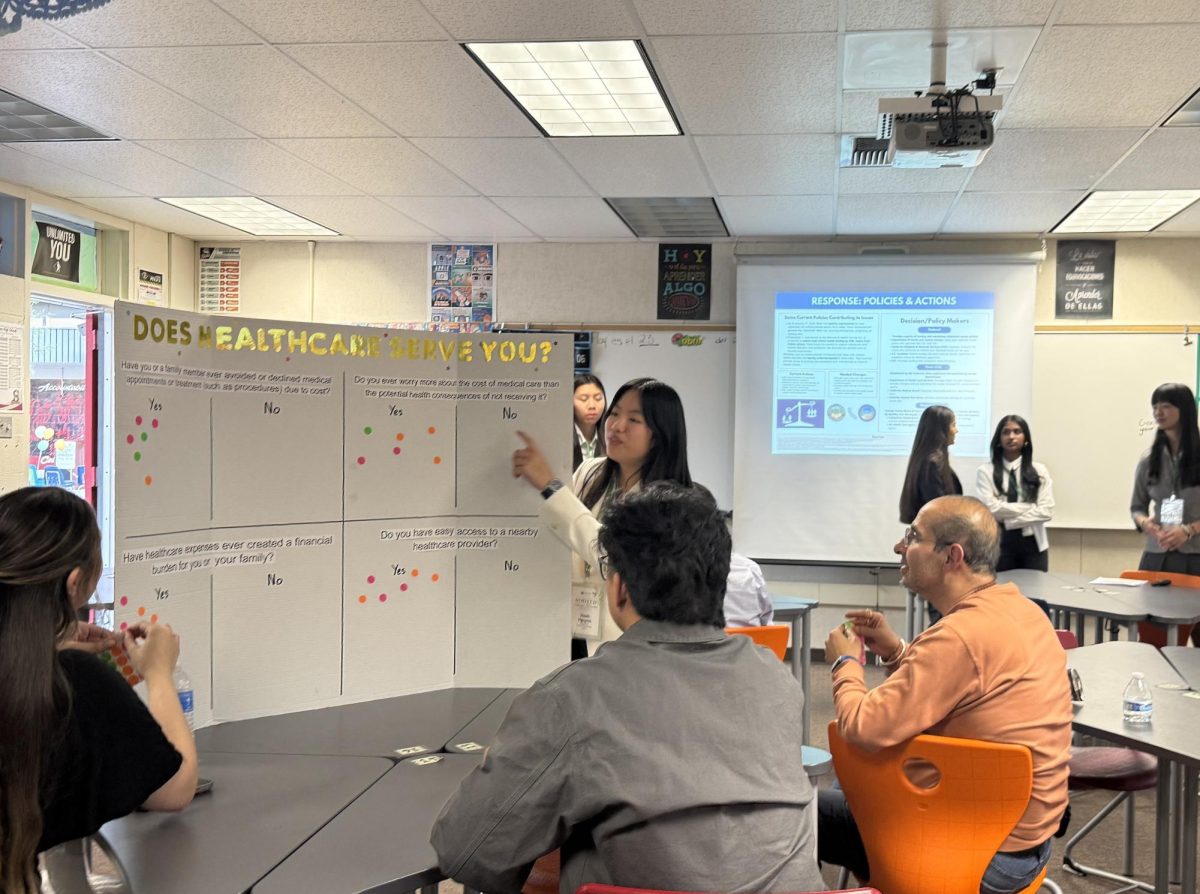 ROOTED in Activism: Oxford sophomore Hanh Nguyen shares her project on healthcare equity and affordability with guests at the Activism Showcase.
