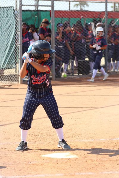 FINISHING STRONG: Freshman softball player Rianne Sampilo prepares to bat, helping her team finish their season along with the other spring sports.